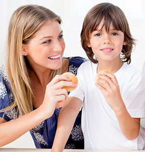The child smiles wide after a pediatric dental checkup in Worcester & Central, MA.
